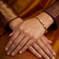 SJJGB110 | Gleam Wave Textured Gold Bangle with Modern Luxury Finish