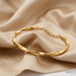 SJJGB110 | Gleam Wave Textured Gold Bangle with Modern Luxury Finish