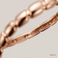 SJJGB118 | Chic Fluidity Rose Gold Bangle with Contemporary Curved Design