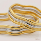 SJJGB119 | Debonair Yellow Gold Waved Bangle with Sophisticated Finish