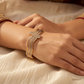 SJJGB119 | Debonair Yellow Gold Waved Bangle with Sophisticated Finish