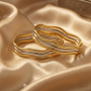 SJJGB119 | Debonair Yellow Gold Waved Bangle with Sophisticated Finish
