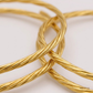 SJJGB132 | Dainty Spiral Gold Bangle with Minimalist Modern Appeal