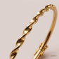 SJJGB139 | Graceful Twisted Gold Bangle with Elegant Contemporary Design