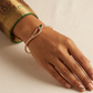 SJJGB141 | Serpentine Grace Gold Bangle with Fluid Curved Elegance