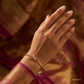 SJJGB156 | Intertwined Radiance Gold Bangle with Artistic Twisted Design