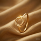 SJJGR151 | Twist Orbit Stylish Gold Ring with Artistic Circular Design